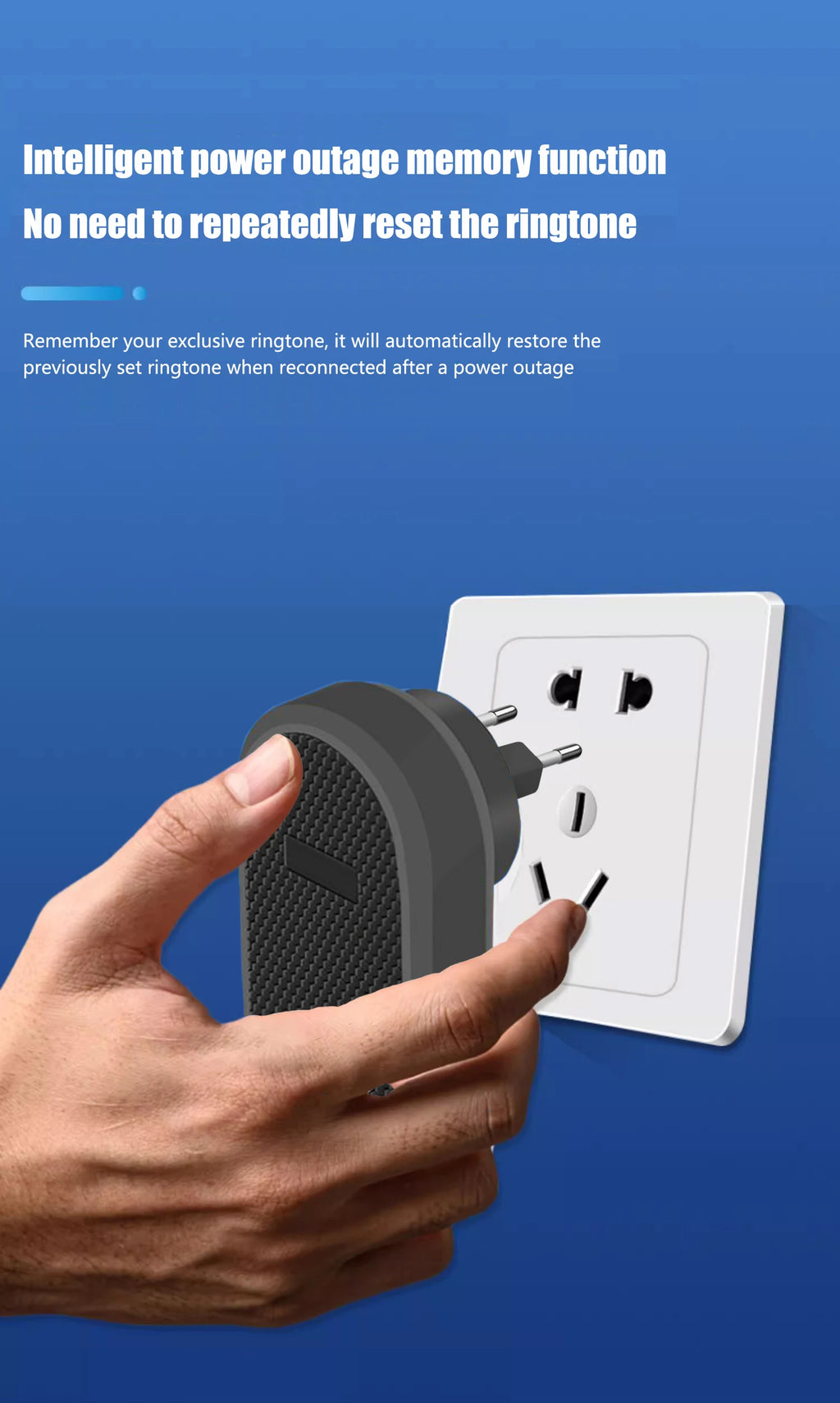 A hand plugging a modern, black wireless doorbell receiver with a textured front into a white wall socket.