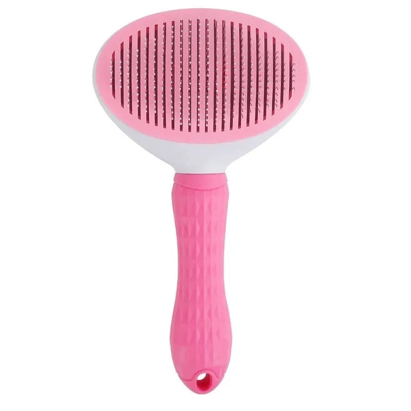 A pink and white pet slicker brush with a textured handle and fine bristles for grooming.