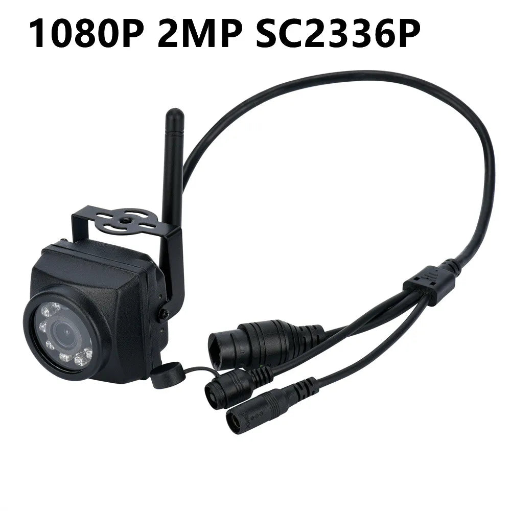 Black 1080P 2MP security camera with antenna, mounting bracket, and wired connectors on a white background.