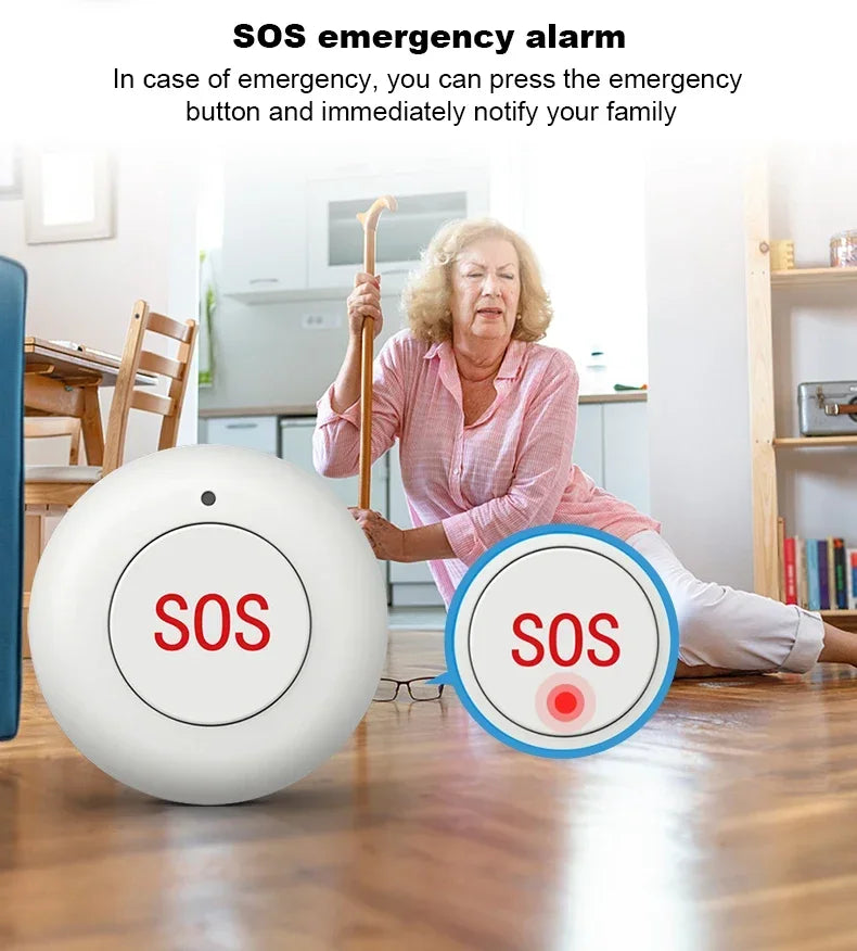 A white, round SOS emergency button displayed in front of an elderly woman sitting on the floor with a walking stick.