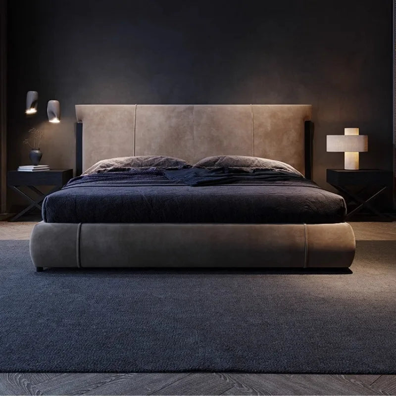 Minimalist black bedside table with cross-base legs and integrated storage, shown in a modern bedroom setting.