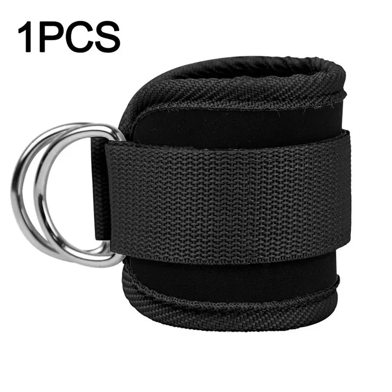 A single black padded ankle strap with metal D-rings for cable machines, featuring a sturdy velcro closure.
