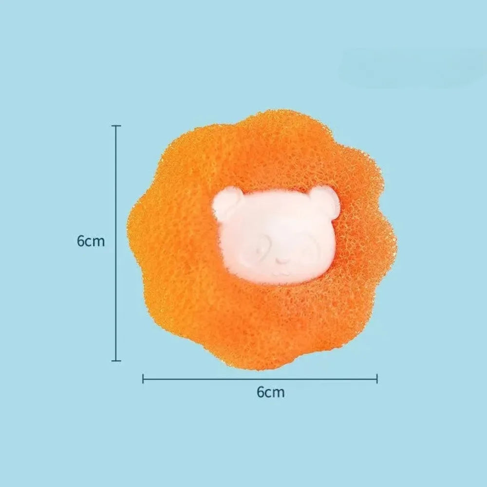 Orange circular scrubbing sponge with a white panda face in the centre, measuring 6cm by 6cm.