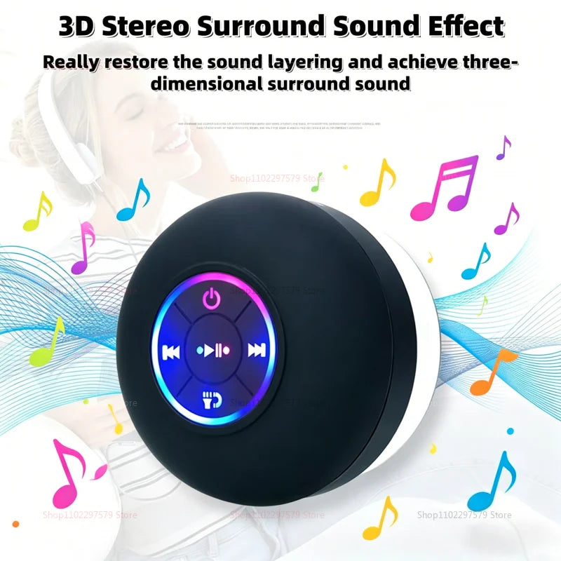 Portable black waterproof Bluetooth speaker with a central glowing LED control panel and suction cup base.