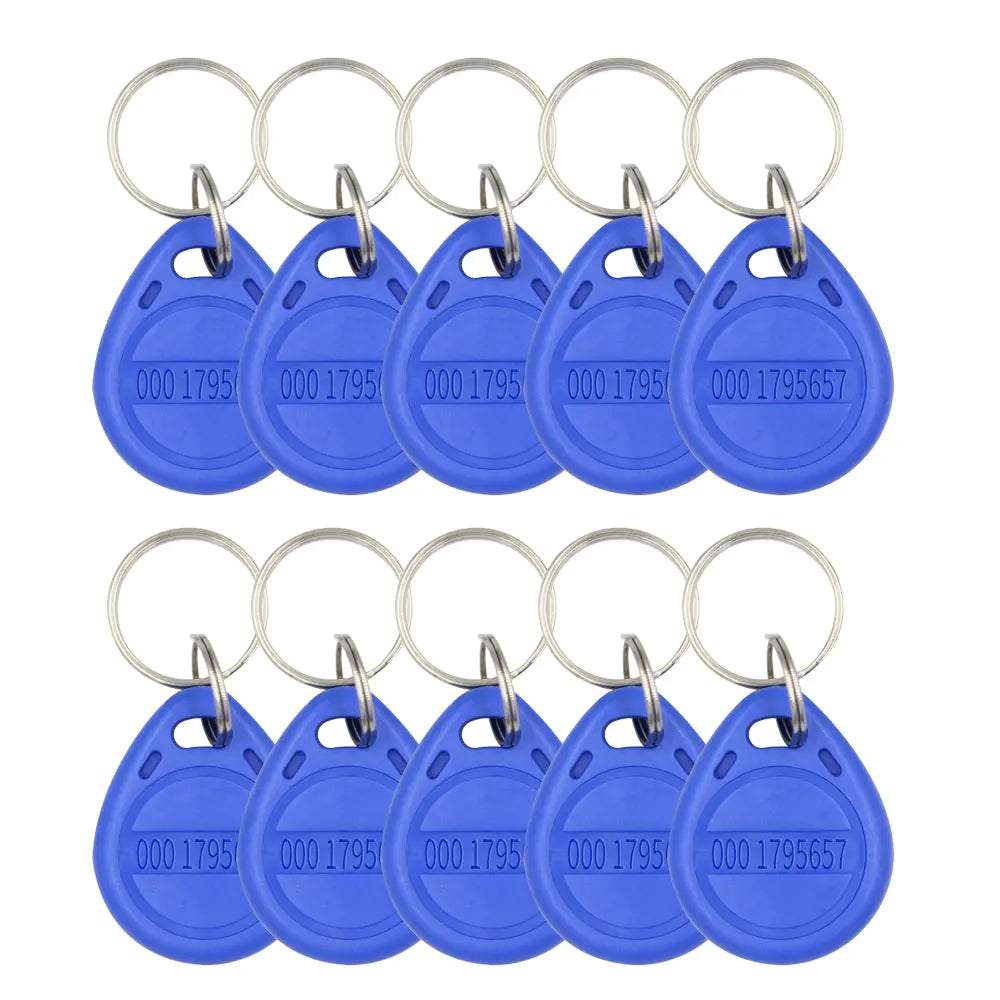 Ten blue plastic RFID key fob tags with metal rings, each featuring a unique stamped ID number.
