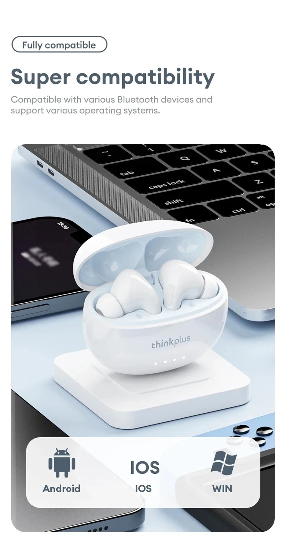 Glossy white wireless earbuds in an open charging case sitting on a square base with a laptop in the background.