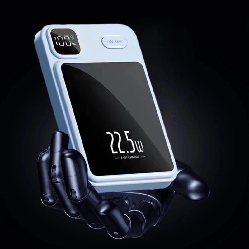 Light blue magnetic power bank with digital display showing 100% and 22.5W, held by a robotic hand.