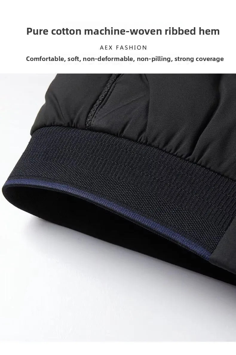 Close-up of a black men's windproof jacket featuring a durable, machine-woven ribbed hem with a subtle blue trim.