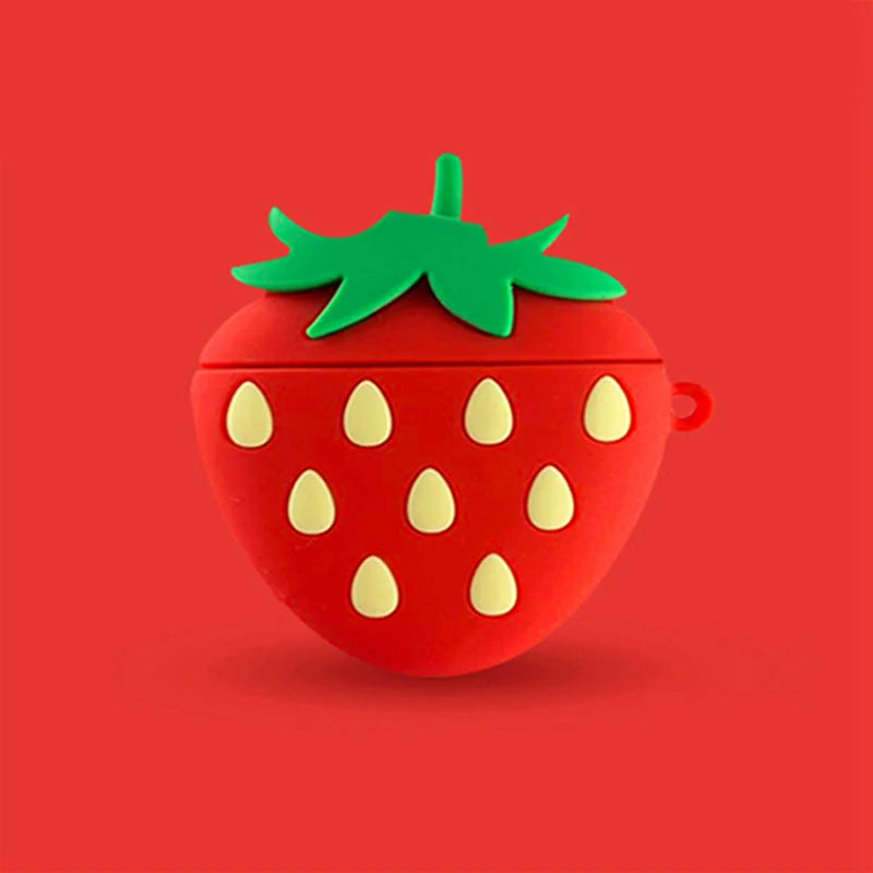 Red silicone strawberry-shaped protective case for AirPods, featuring a green leaf top and cream-coloured seeds.