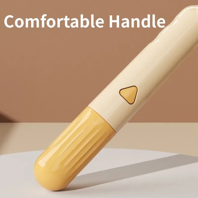 Close-up of a cream and yellow ergonomic cleaning brush handle with a triangular button on a neutral background.
