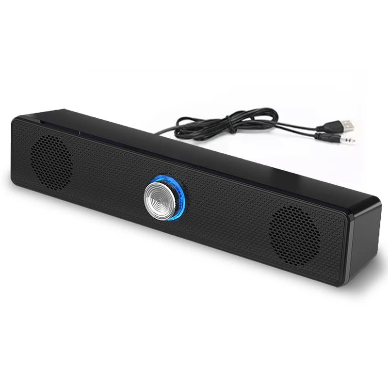 Black USB stereo computer soundbar with two speakers, central silver volume knob, and blue LED light ring.