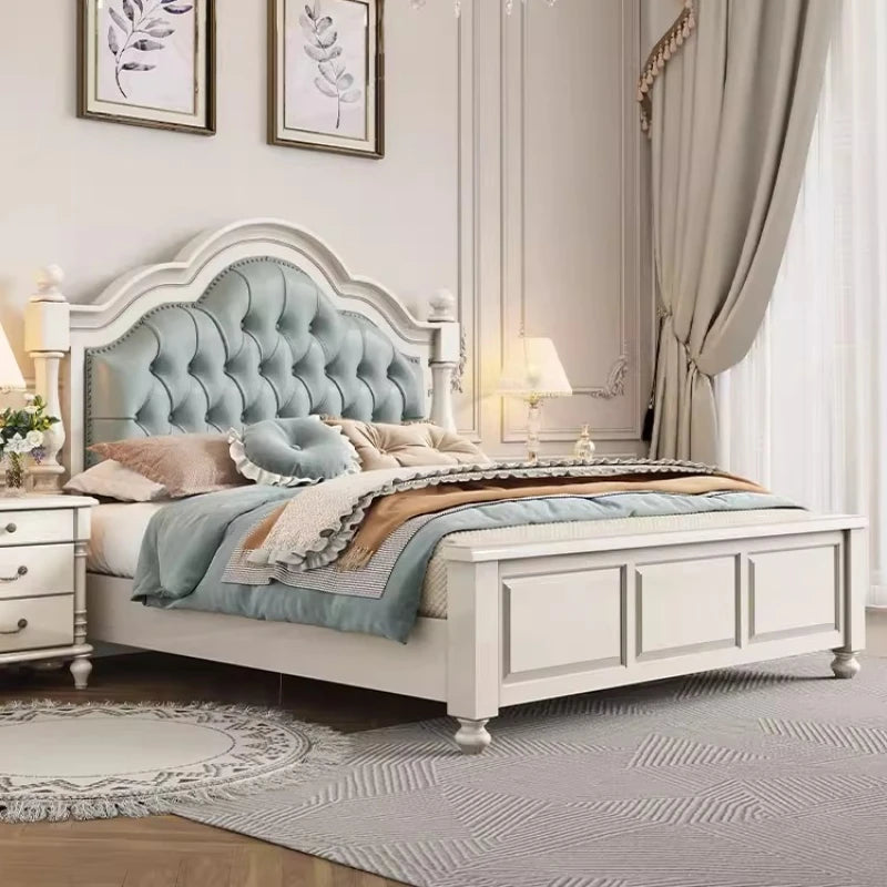 Classic white double bed frame with a button-tufted, sage-green upholstered arched headboard.