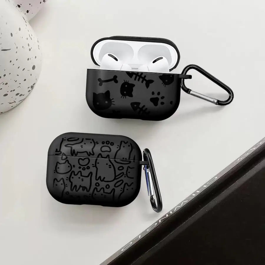 Black silicone AirPods Pro case featuring playful cat and fishbone print, complete with a metal carabiner clip.