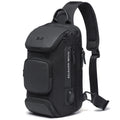 Black anti-theft crossbody bag with a single padded shoulder strap, multiple zipped compartments and external USB port.