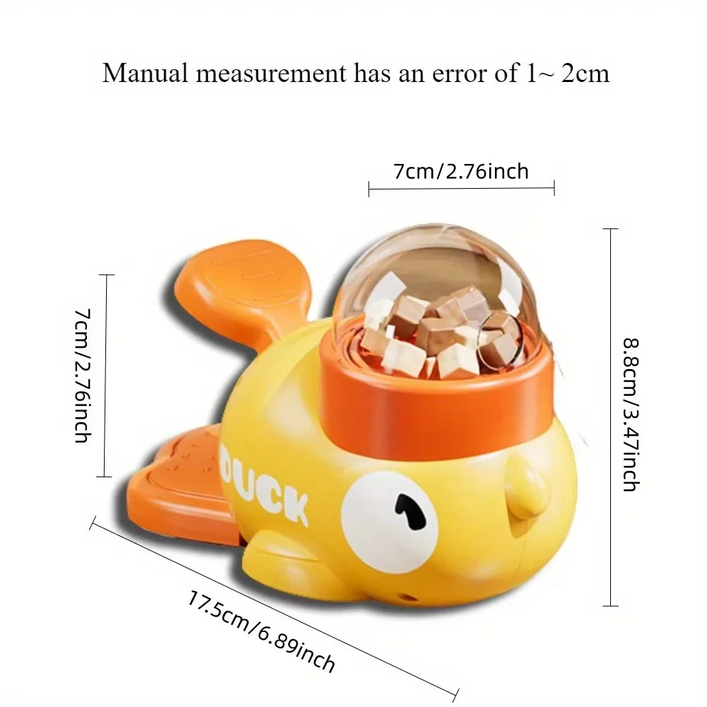 Yellow duck-shaped toy with a clear dome filled with small cubes, featuring orange accents and measurement labels.