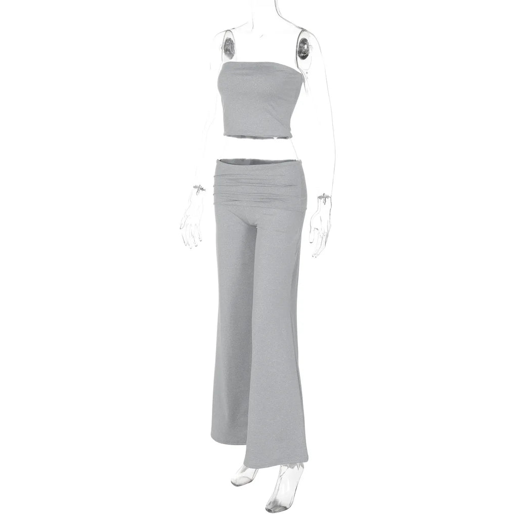 Grey two-piece set featuring a strapless crop top and high-waisted, wide-leg trousers on a mannequin.