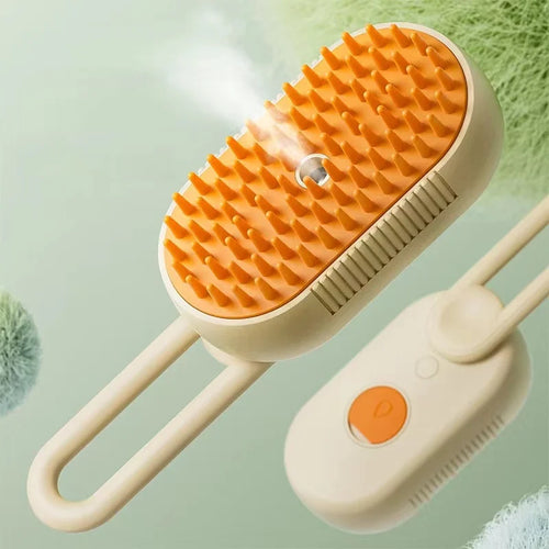 Beige and orange pet steam grooming brush with soft silicone bristles and a handheld design.