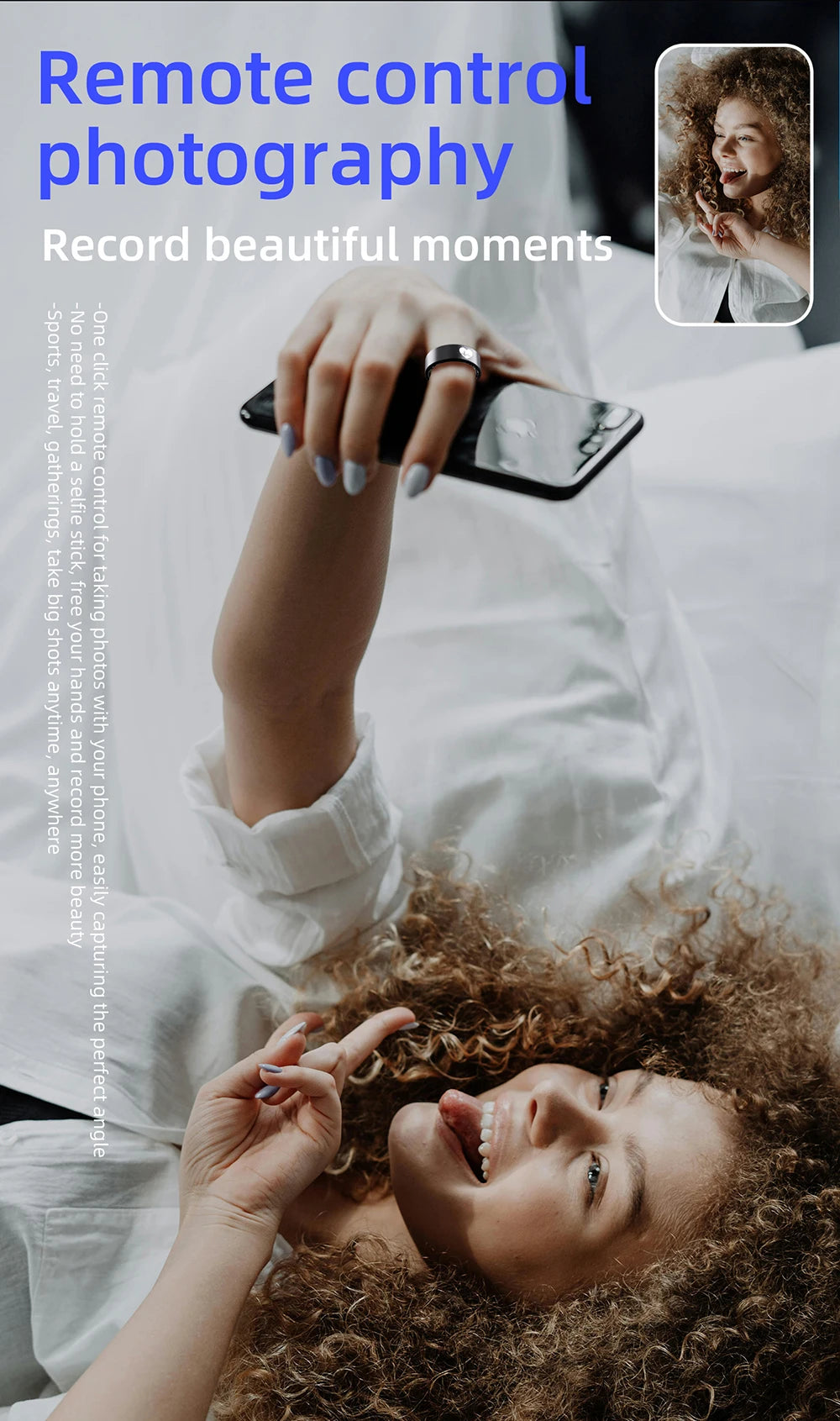 A sleek black smart fitness ring worn on a finger while using a smartphone for remote photography.