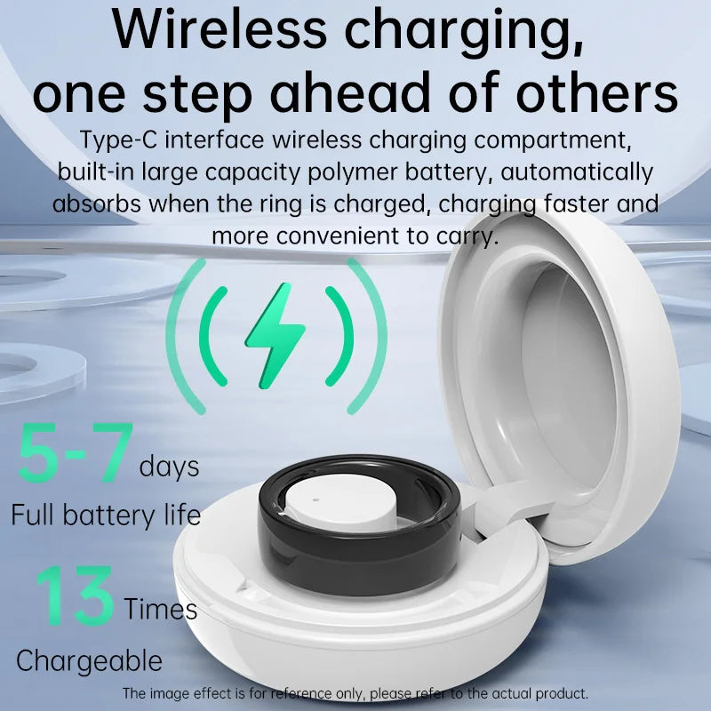 A black smart fitness ring sits inside its open, white circular wireless charging case.