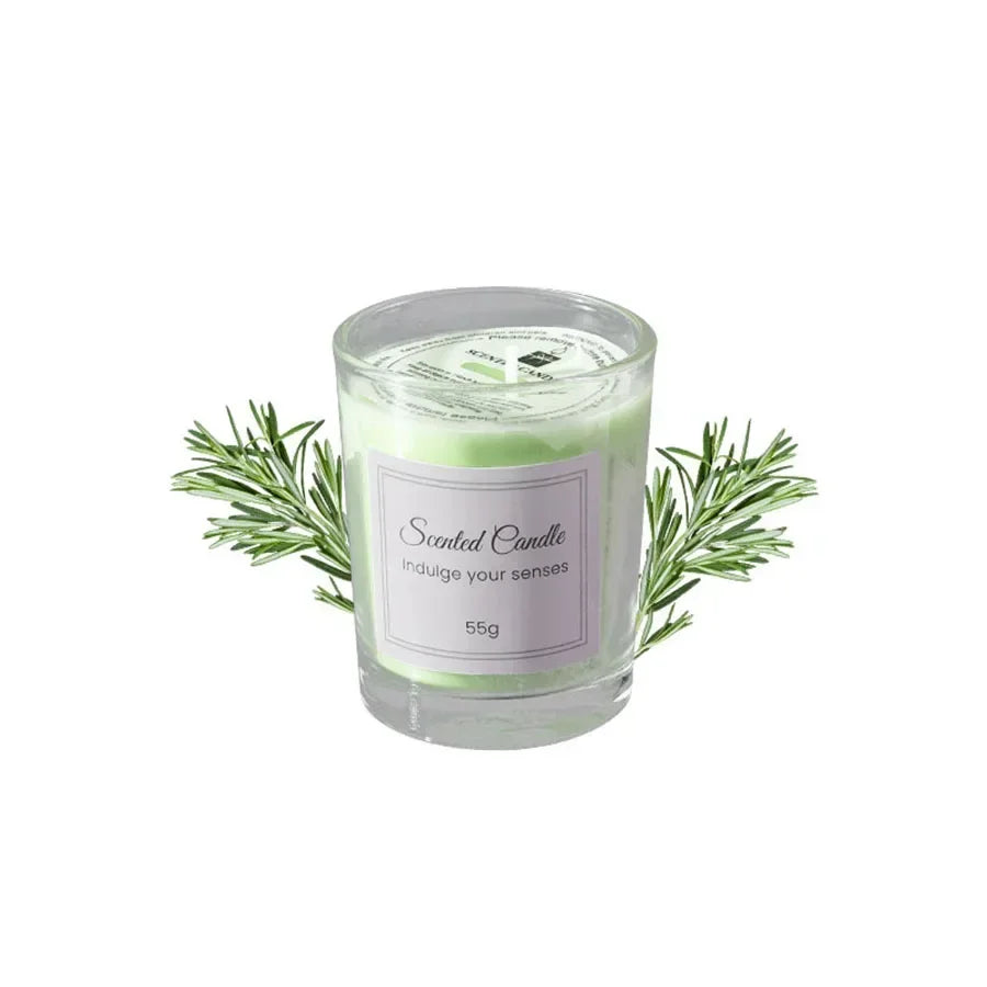 A small, pale green scented candle in a glass votive, decorated with sprigs of fresh rosemary.