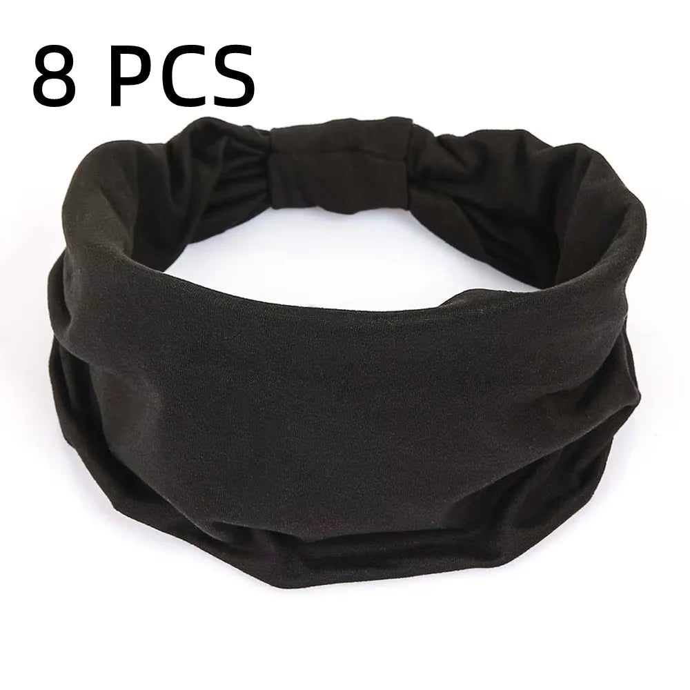 A pack of 8 black fabric elasticated headbands with a ruched, wide-fit design on a white background.