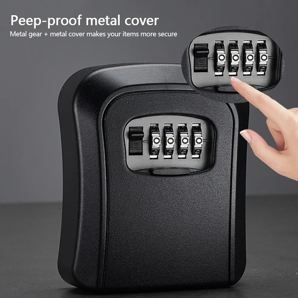 Black metal wall-mounted key lock box with a four-digit combination dial and a sliding protective cover.