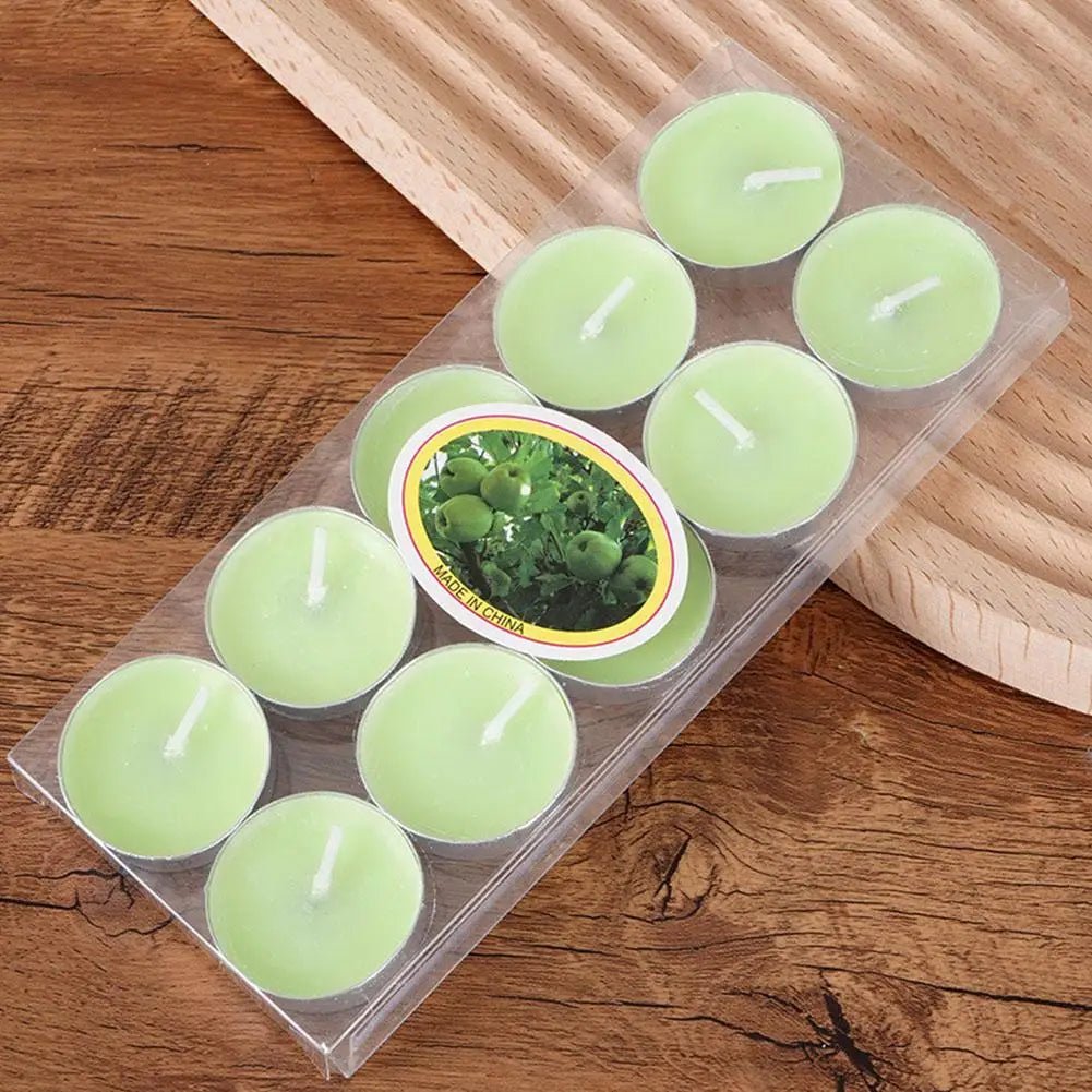 Pack of ten round, light green tea light candles in clear plastic packaging with apple-themed label.
