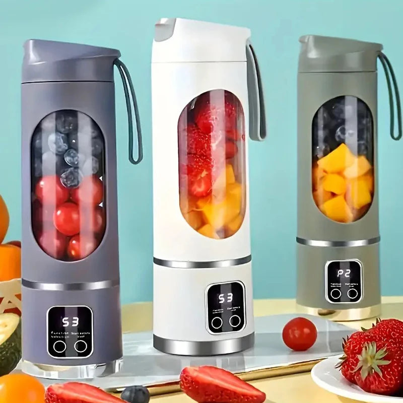 Three portable electric blenders in grey, white, and sage green, each with a digital display and clear fruit container.