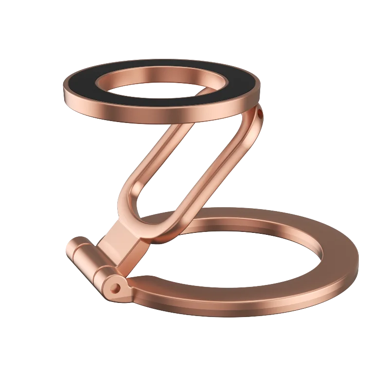 Rose gold, foldable, circular magnetic phone stand with a black grip surface, isolated on a black background.