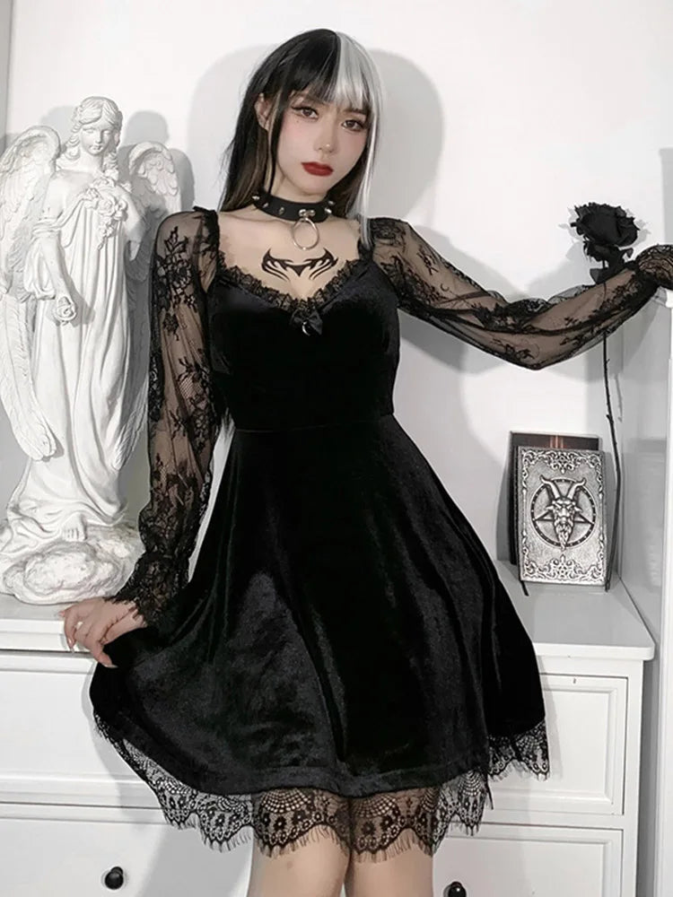 Black velvet A-line mini dress with sheer lace sleeves, V-neck, and lace hem, worn by a model.
