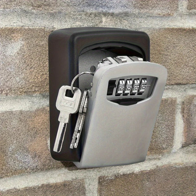 Black and silver metal wall-mounted key lock box with a four-digit combination code dial.