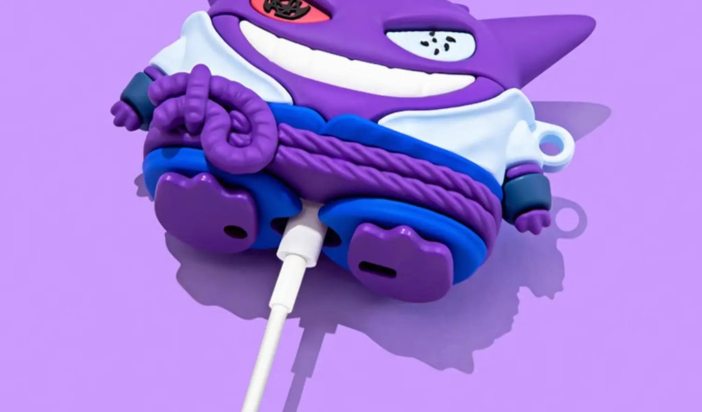 Purple Gengar silicone AirPods case with Naruto-style design, charging via cable on a lilac background.