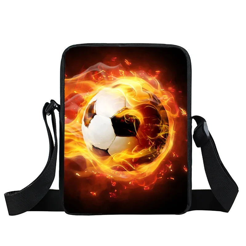 Black shoulder bag featuring a graphic print of a soccer ball engulfed in vibrant orange and yellow flames.