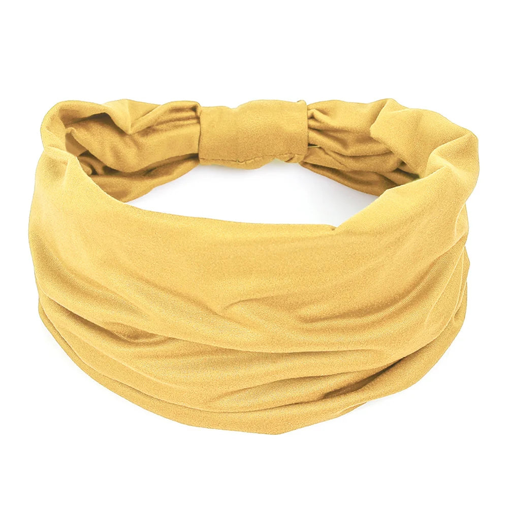 Mustard yellow wide fabric headband with a soft, gathered, and ruched texture.