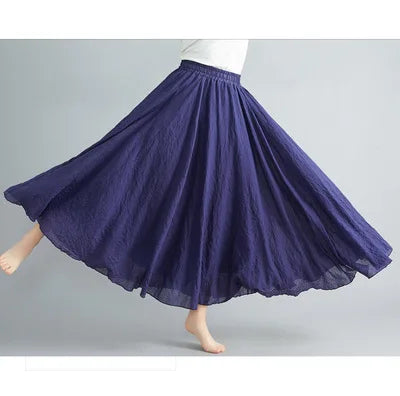Flowy, dark blue A-line maxi skirt with an elasticated waistband and textured, lightweight fabric.