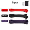 Set of 3 resistance bands in red (20kg), black (26kg), and purple (45kg), with a carry bag and exercise guide.