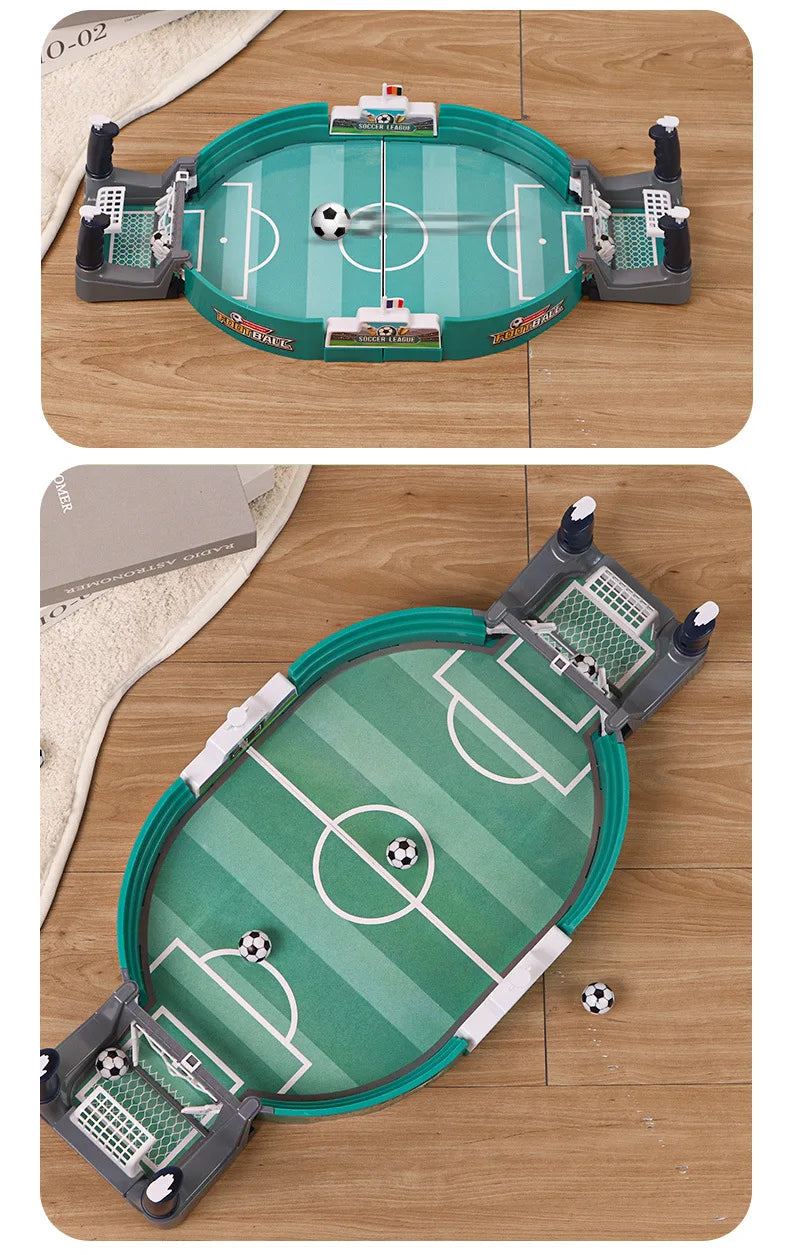 Tabletop football game with a green oval pitch, grey goal units, and small white and black soccer balls.