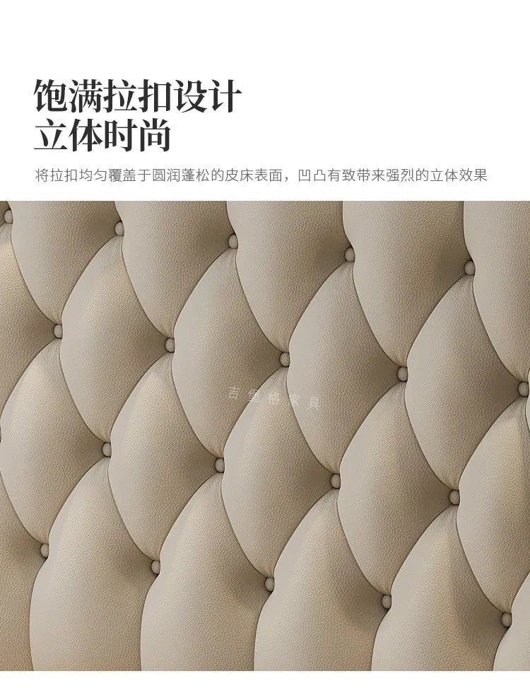 Close-up of a modern, beige upholstered bed headboard featuring a luxurious, deep-buttoned tufted design.