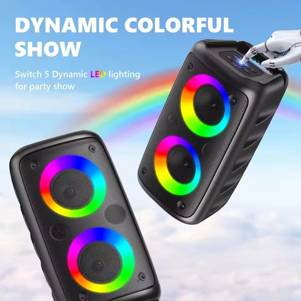 Two black portable karaoke speakers with colourful, circular LED light rings on a sky-blue background with a rainbow.