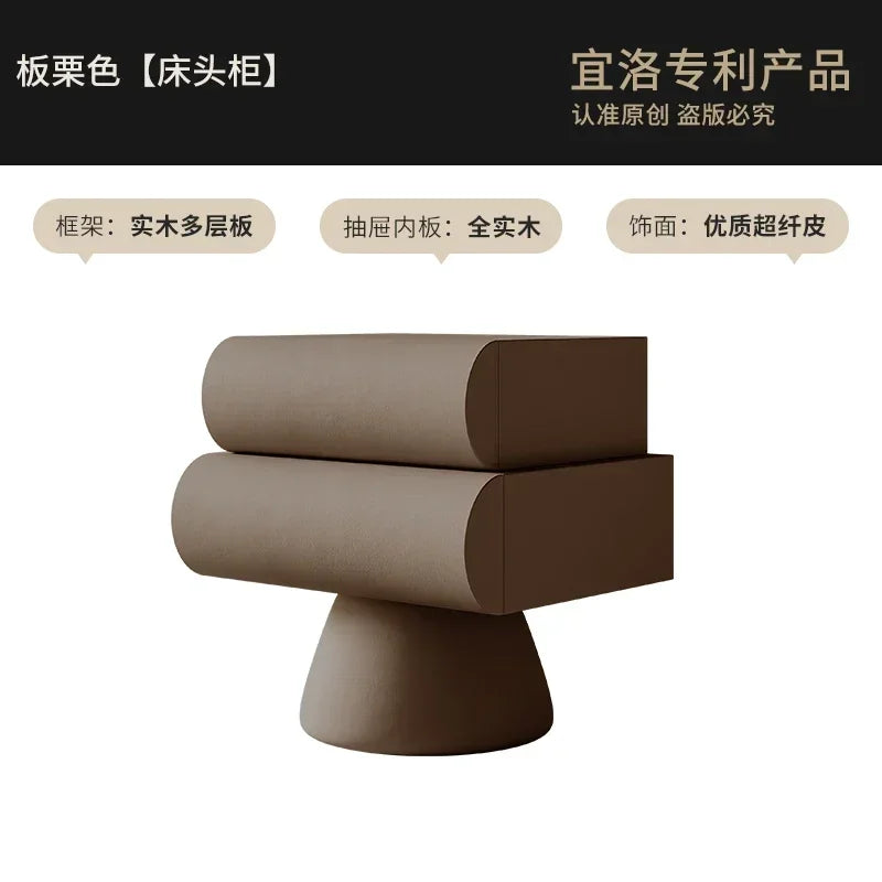 A modern, taupe-coloured floating bedside table with two rounded drawers on a tapered, sculptural pedestal base.