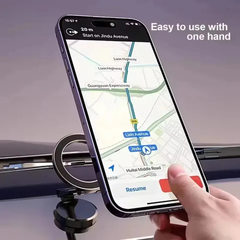 Black magnetic car phone mount holding a smartphone with navigation displayed, showing one-handed operation.