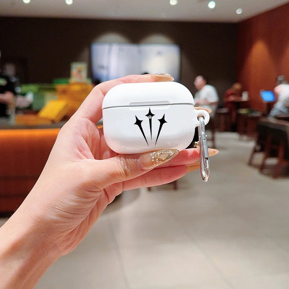White glossy AirPods Pro case with a black star motif, featuring a silver side carabiner.