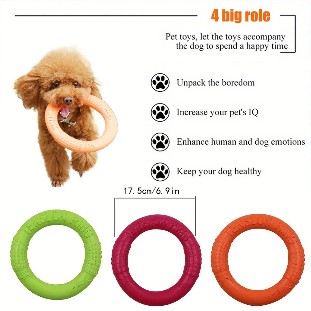 A small brown dog carrying a durable orange EVA flying disc ring, with green, red, and orange ring options below.