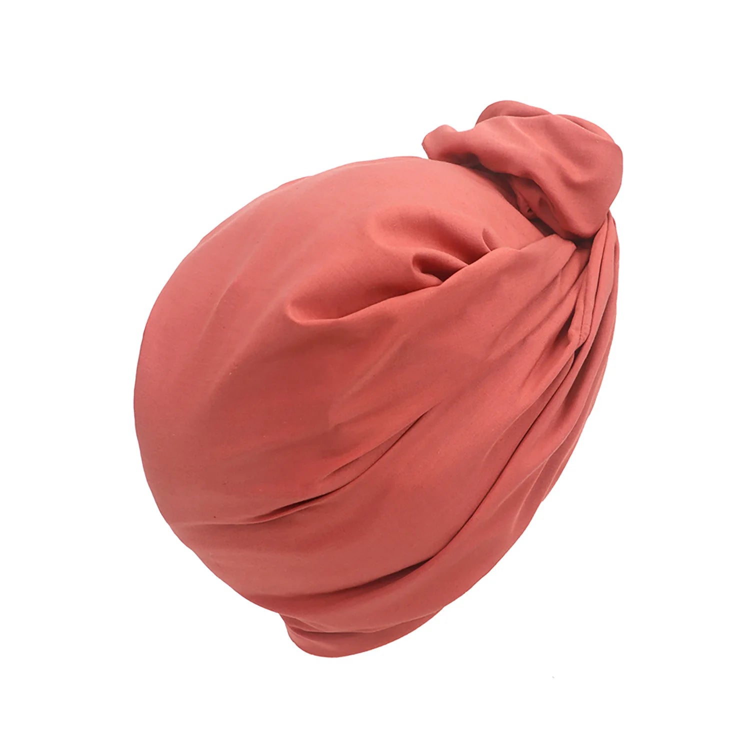 Terracotta pink French-style turban hat with a soft, knotted front detail and smooth, gathered fabric finish.