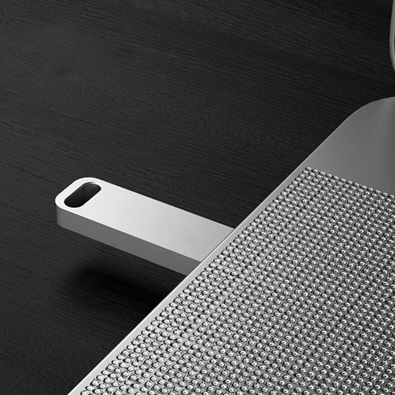 A sleek, silver metal USB flash drive with a textured grip, featuring a hole for a lanyard on a dark surface.