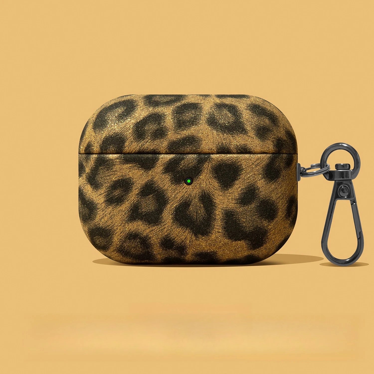 Gold leopard-print glitter AirPods Pro case with a black metal keyring clip.