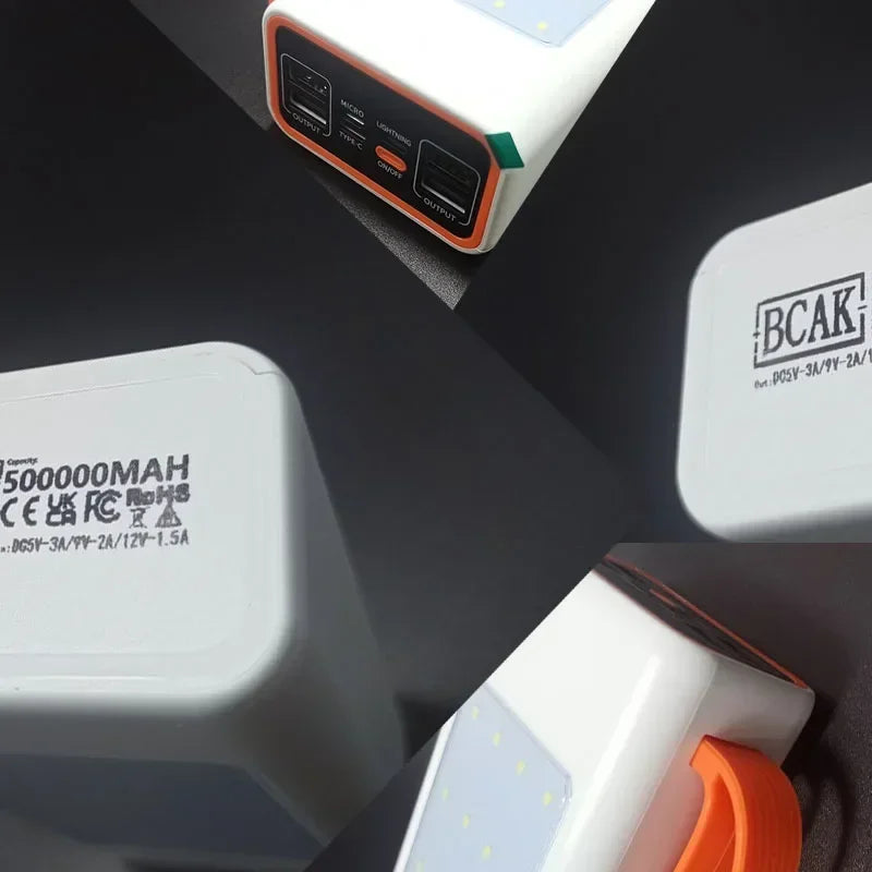 White portable power bank with orange accents, featuring multiple charging ports, an LED light panel, and carry handle.