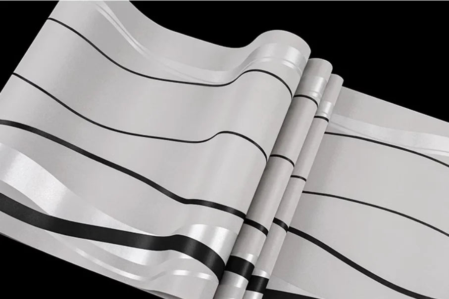 Modern grey wallpaper featuring minimalist, sweeping black horizontal stripes on a light, subtle textured background.