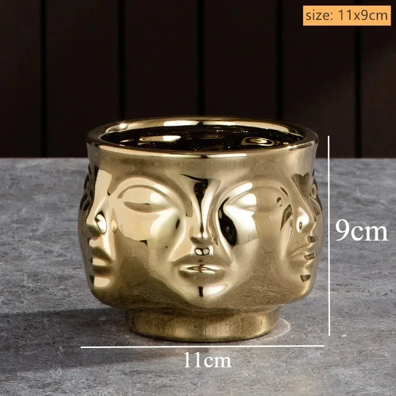 Glossy gold ceramic planter featuring a decorative 3D multi-face design, measuring 11cm wide by 9cm high.