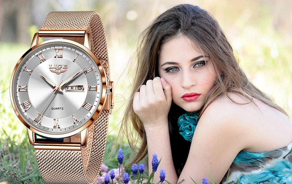 Elegant rose gold mesh bracelet watch with a silver sunray dial, Roman numerals and a day-date display.